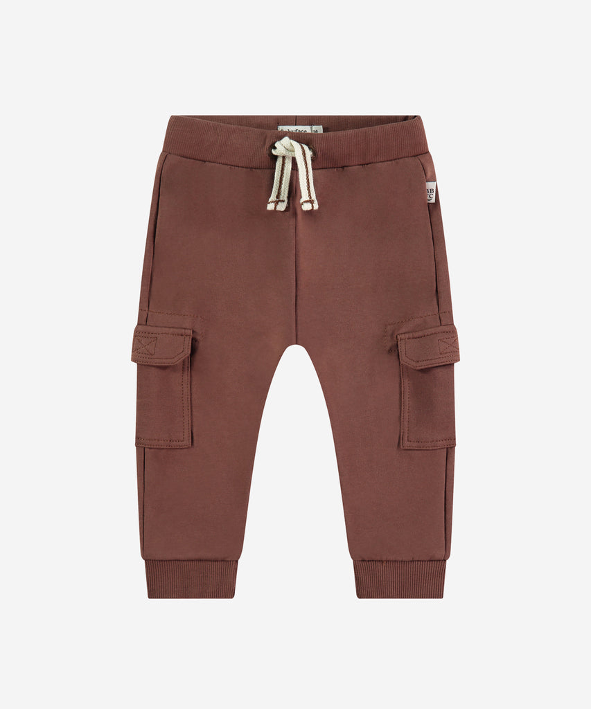 Details: These Baby Jogg Pants in chocolate brown are designed to provide comfort and functionality. The elastic waistband ensures a snug fit, while the pockets allow for convenient storage. Perfect for any active baby, these jogging pants come in a stylish chocolate brown color.&nbsp;
Color: Chocolat&nbsp;
Composition: 95% BCI cotton/5% elasthan &nbsp;