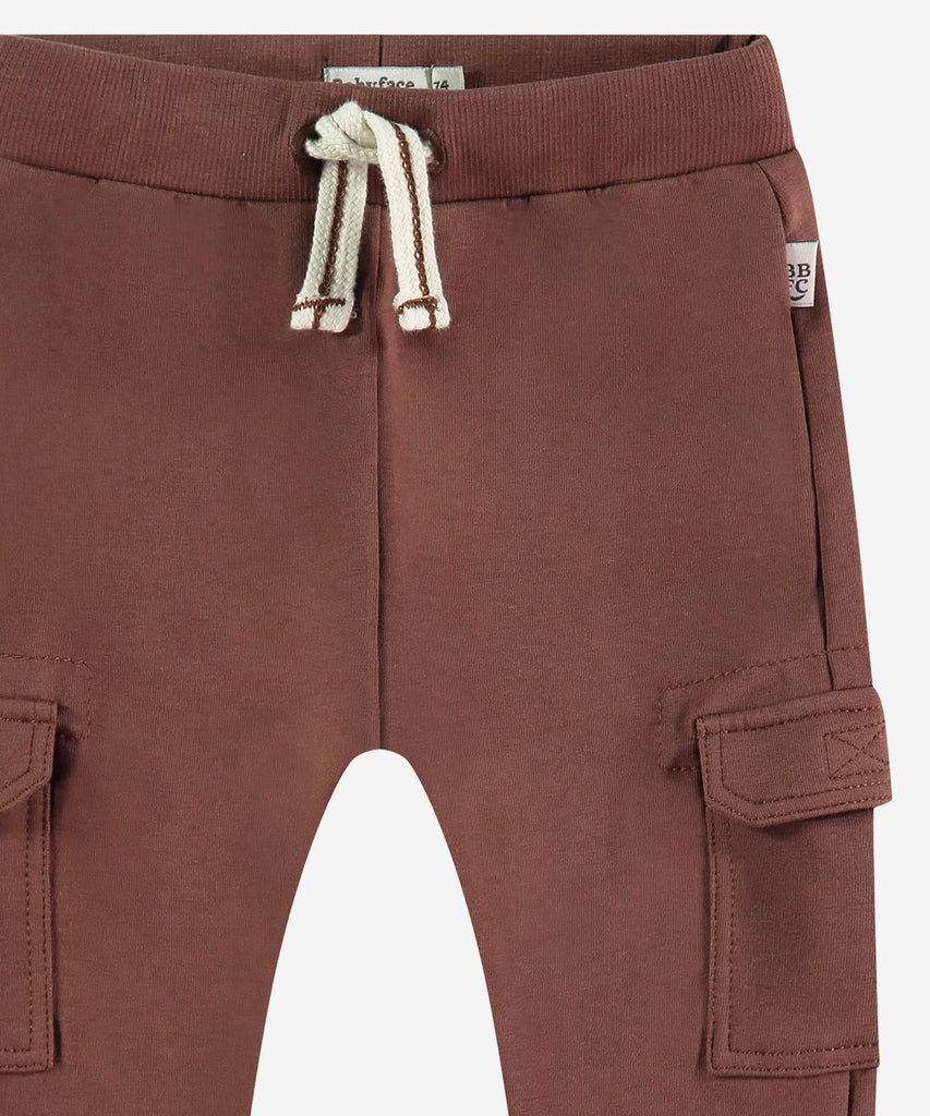 Details: These Baby Jogg Pants in chocolate brown are designed to provide comfort and functionality. The elastic waistband ensures a snug fit, while the pockets allow for convenient storage. Perfect for any active baby, these jogging pants come in a stylish chocolate brown color.&nbsp;
Color: Chocolat&nbsp;
Composition: 95% BCI cotton/5% elasthan &nbsp;