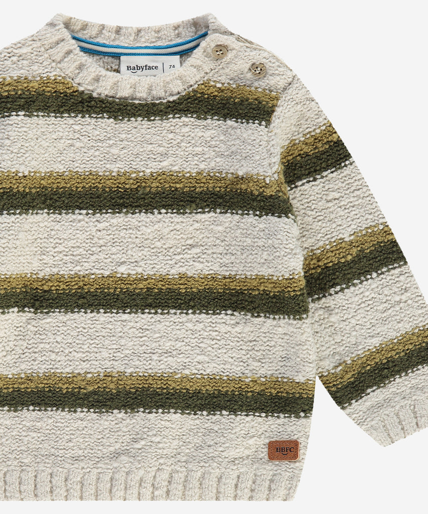 Details: &nbsp;This baby pullover is made of knitted bouclé fabric, providing warmth and comfort for your little one. The stylish stripes add a pop of color while the round neckline offers a classic look. With pushbuttons on the side of the collar, dressing up is a breeze.&nbsp;
Color: Bone&nbsp;&nbsp;
Composition:&nbsp;80% cotton/20% polyester &nbsp;