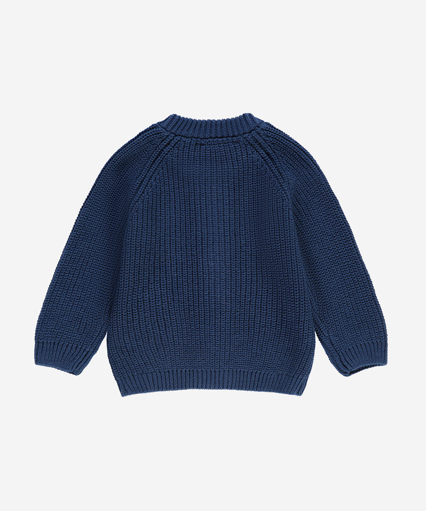 Details: &nbsp;This blue baby knit zip cardigan is designed with ribbed arm cuffs and waistband, as well as a round neckline, for a comfortable and stylish look. Keep your little one warm and cozy without sacrificing style. The perfect addition to any baby's wardrobe.&nbsp;
Color: Dark blue&nbsp;
Composition:&nbsp; Winter'24 &nbsp;