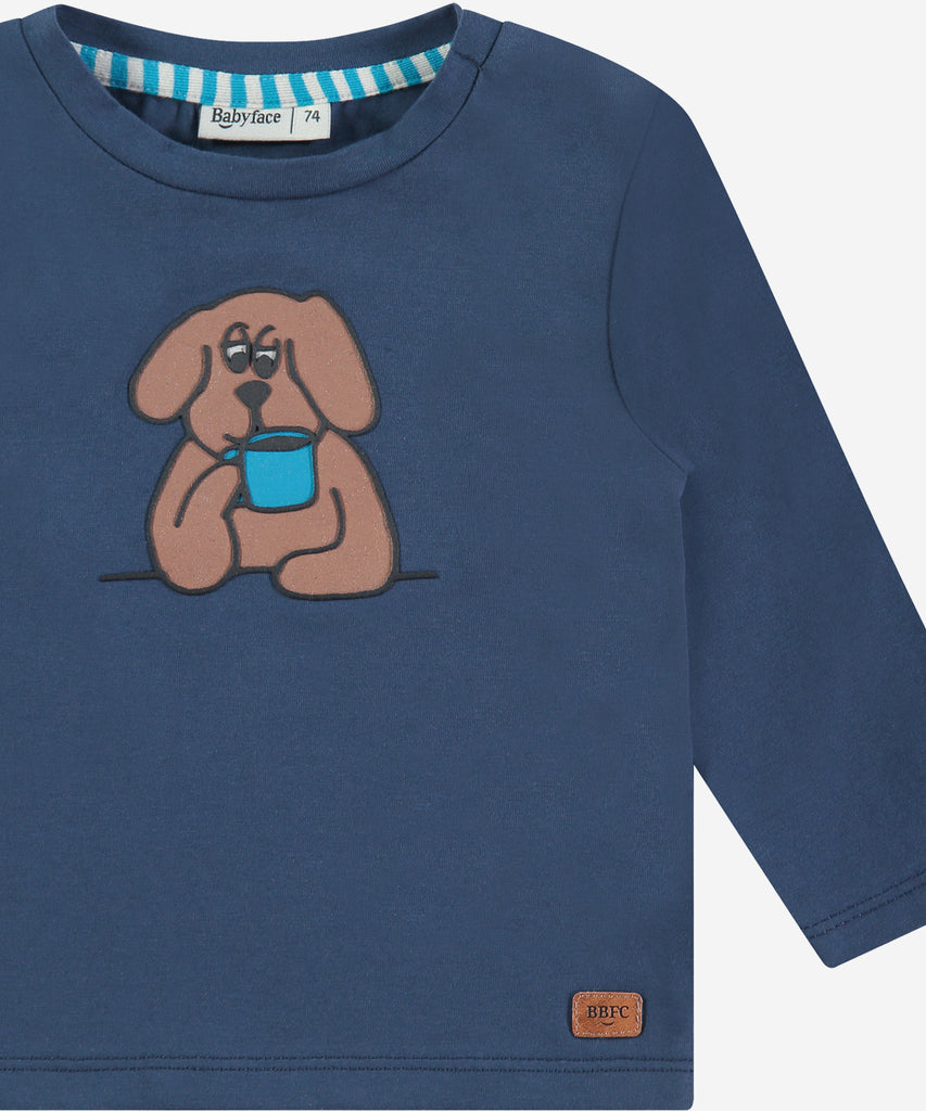 Details:&nbsp; This fashionable baby long sleeve t-shirt is made with a Dog print on the front, a round neckline, and push buttons on the side for easy opening. Perfect for any little one, this long sleeve t-shirt provides both comfort and style.&nbsp;
Color: Blue&nbsp;
Composition:&nbsp; 95% BCI cotton/5% elasthan &nbsp;