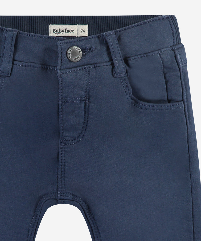 Details:&nbsp;These dark blue baby soft canvas pants are a must-have for any little one. With functional pockets, sturdy belt loops, and a secure button and zip closure, these pants offer both comfort and convenience. Made from soft canvas material, your baby will stay cozy all day long.&nbsp; Color:&nbsp;Dark blue&nbsp;&nbsp; Composition: 98% cotton/2% elasthan &nbsp;