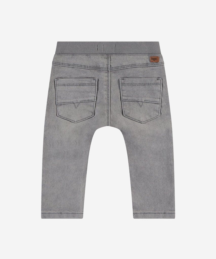 Details: These grey baby soft jogg pants are a must-have for any little one. With functional pockets, sturdy belt loops, an elastaic waistband and secure button closure, these pants offer both comfort and convenience. Made from soft canvas material, your baby will stay cozy all day long.&nbsp;
Color: Grey denim&nbsp;
Composition: 98% cotton/2% elasthan &nbsp;
