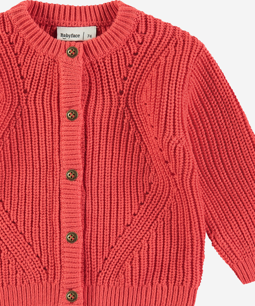 Details: &nbsp;This red Baby Rib Knit Cardigan is expertly crafted with a ribbed knit design and features a classic round neckline. The button closure ensures a secure fit. Your little one will stay warm and stylish in this cozy cardigan.&nbsp;
Color: Red&nbsp;
Composition:&nbsp; 100% cotton. &nbsp;