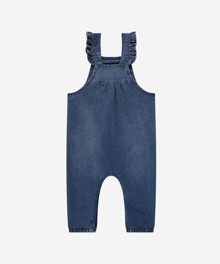 Details:&nbsp; Crafted from soft jeans material, these Baby Dungarees in Blue denim are the perfect addition to your little one's wardrobe. With pockets, these dungarees are both practical and comfortable. Perfect for all-day wear, your baby will look and feel great in these cozy dungarees.&nbsp;
Color: Jeans blue&nbsp;&nbsp;
Composition: 76% cotton/23% polyester /1% elasthan &nbsp;