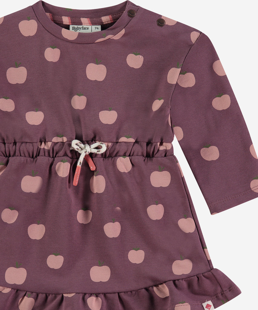 Details:&nbsp; This fashionable baby sweatdress is made with an all over Apple print, a round neckline and push buttons on the side for easy opening. Perfect for any little one, this Dress provides both comfort and style.&nbsp;
Color: Purple&nbsp;
Composition:&nbsp; 95% BCI cotton/5% elasthan &nbsp;