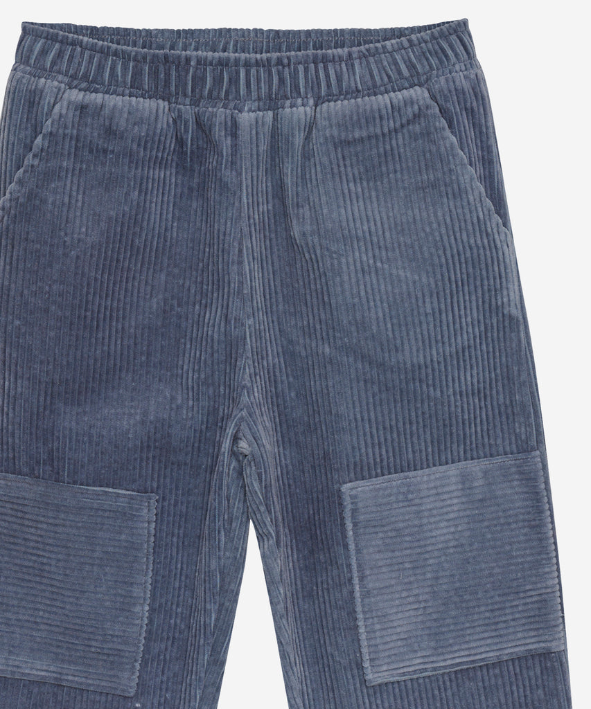 Details: &nbsp;Expertly crafted in a timeless stone blue hue, these corduroy pants offer both style and comfort. The elastic waistband provides a customizable fit, while the pockets offer practicality. Perfect for any occasion, these pants are sure to become a staple in your wardrobe. Color: Stone blue&nbsp; Composition:&nbsp; Organic woven Corduroy 100% Cotton &nbsp;