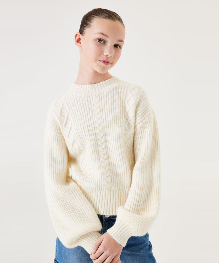 Details: &nbsp;This cable knit pullover in a cream off white color is the perfect addition to any wardrobe. Its round neckline provides a classic and versatile look, while the ribbed arm cuffs and waistband ensure a comfortable fit. Made with high-quality knitting techniques, this pullover is durable and will keep you warm during the colder months.&nbsp;
Color: Cream off white&nbsp;
Composition:&nbsp; 42% Acryl, 31% Polyamide, 27% Polyester &nbsp;&nbsp;