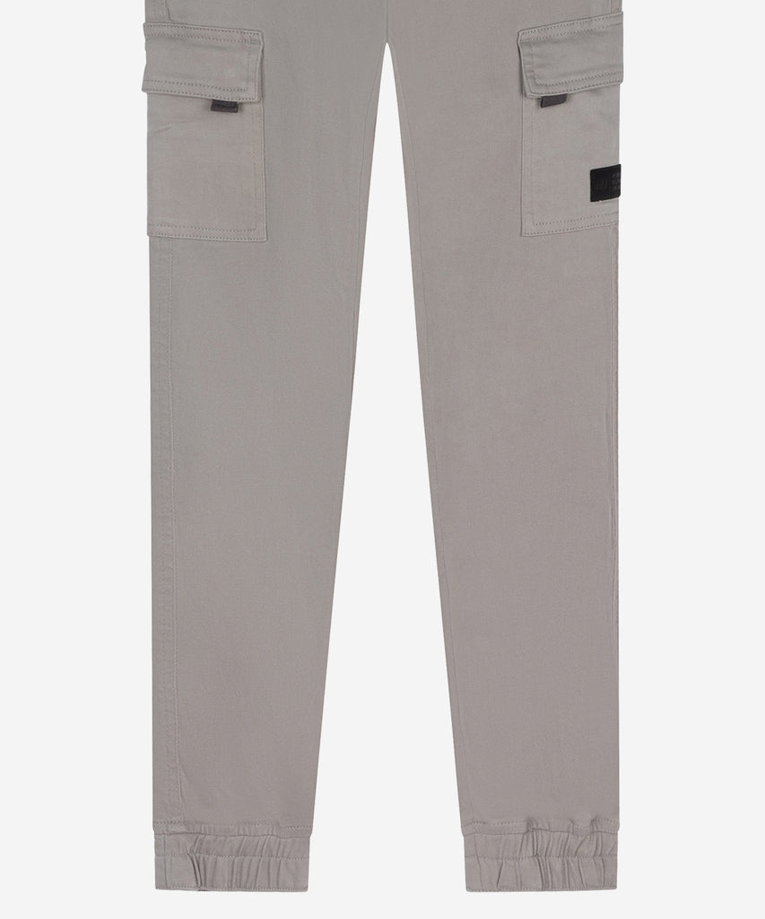 Details: &nbsp;These light grey cargo canvas pants are the perfect combination of style and functionality. With multiple pockets, belt loops, and a zip and button closure, these pants not only provide ample storage space but also a comfortable and secure fit. The pockets on the side of the leg add additional convenience for any task at hand.&nbsp; &nbsp; Color: Light Grey&nbsp; Composition:&nbsp; 98% Cotton/ 2% Elastane &nbsp;