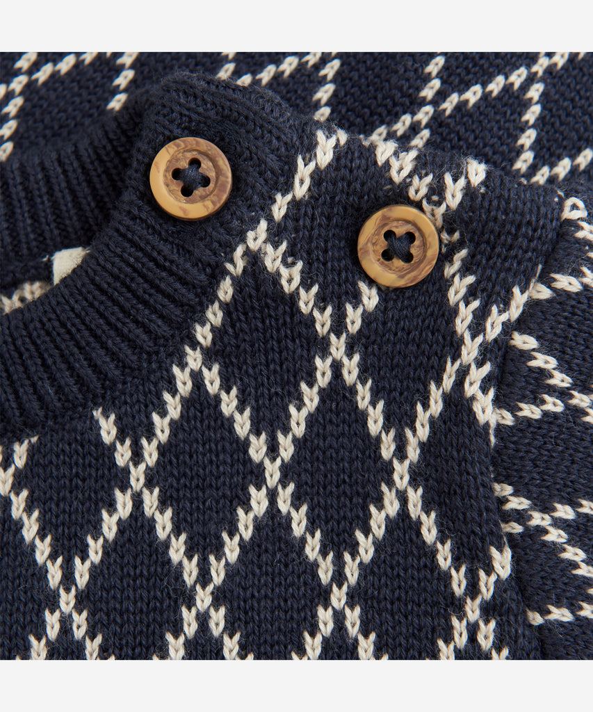 Details:&nbsp;This expertly-crafted Baby Knit Pullover is made with a soft knitted fabric, perfect for your little one's delicate skin. The classic design allows for easy pairing with any outfit. Keep your baby cozy and stylish with this essential piece. Round Neckline.&nbsp; Color: Night blue&nbsp; Composition:&nbsp; Organic Knit 100% Cotton &nbsp;