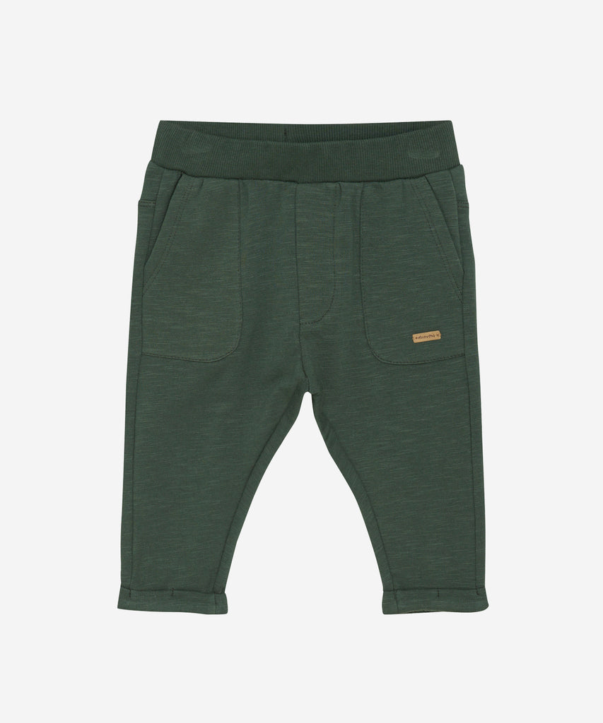 Details:&nbsp;These baby jogg pants are designed with comfort and style in mind. Soft and lightweight, each pair is equipped with an elastic waistband. Perfect for everyday wear.&nbsp;
Color: Jungle green&nbsp;
Composition:&nbsp; Organic Sweat-slub Yarn 95% Cotton/ 5% Elastane &nbsp;