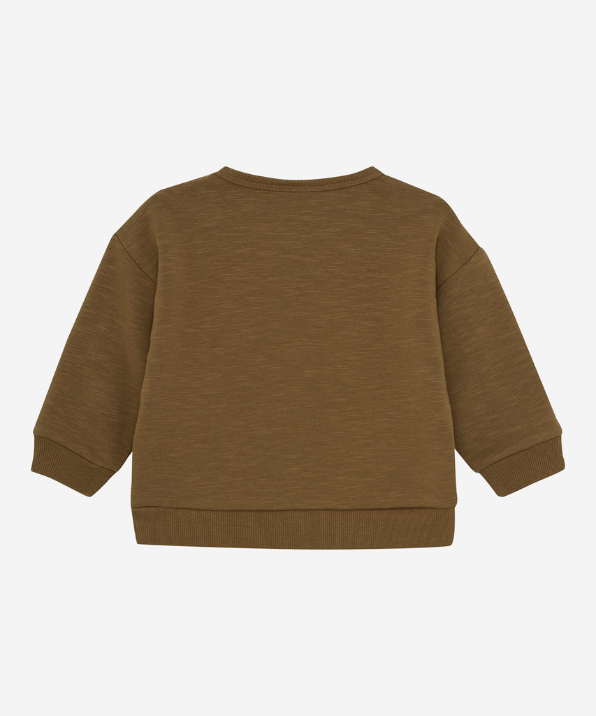 Details:&nbsp; This taupe baby sweater features an adorable Dachshund design on the front, making it a charming addition to your little one's wardrobe. The round neckline and buttons on the side of the collar make it easy to dress your baby, while keeping them comfortable and cozy. Perfect for any occasion.&nbsp; Color: Brown&nbsp; Composition:&nbsp; Organic Sweat-slub Yarn 95% Cotton/ 5% Elastane&nbsp;