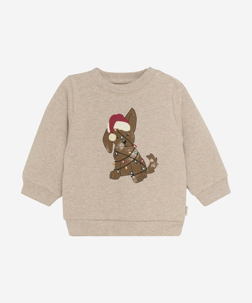 Details: &nbsp;This adorable Baby Sweater in Brown Melee is perfect for the holiday season! With a round neckline and convenient push buttons on the side of the collar, dressing your little one couldn't be easier. Plus, the cute X-Mas Doggie design on the front adds a festive touch. Made of cozy, high-quality material for maximum comfort.&nbsp;
Color: Brown melee&nbsp;
Composition: Sweat Brushed 90% Cotton/ 5% Polyester/ 5% Elastane