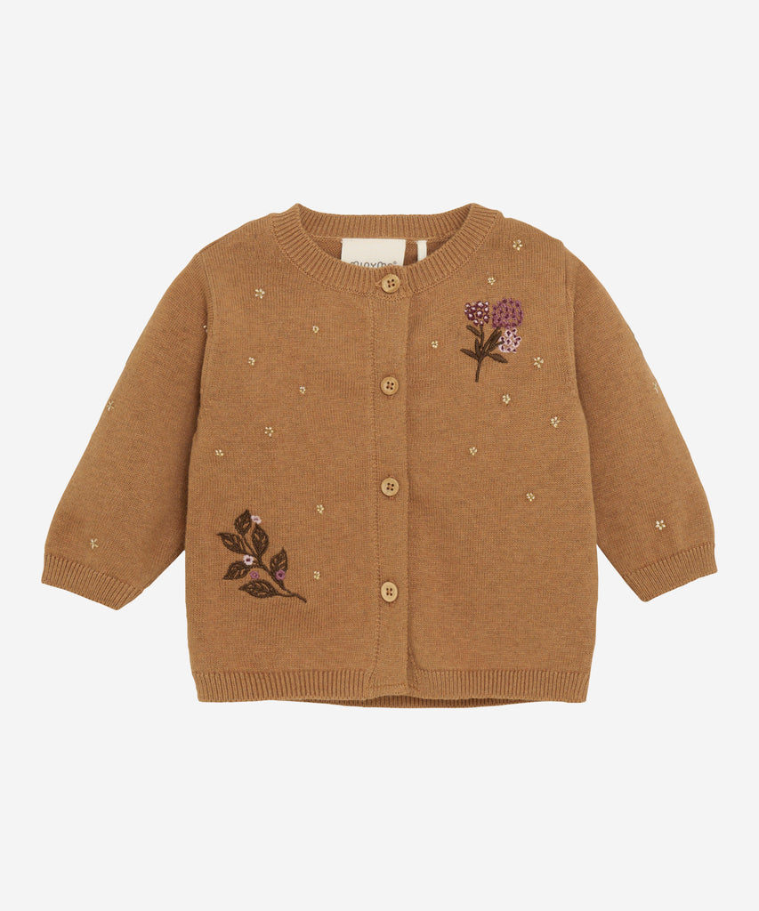 Details:&nbsp;This Baby Knit Cardigan is made with a soft knitted fabric and embroided flowers, perfect for your little one's delicate skin. The button closure adds convenience and security, while the classic design allows for easy pairing with any outfit. Keep your baby cozy and stylish with this essential piece. Round Neckline.&nbsp;
Color: Beige melee&nbsp;
Composition:&nbsp; Organic Knit 100% Cotton &nbsp;
