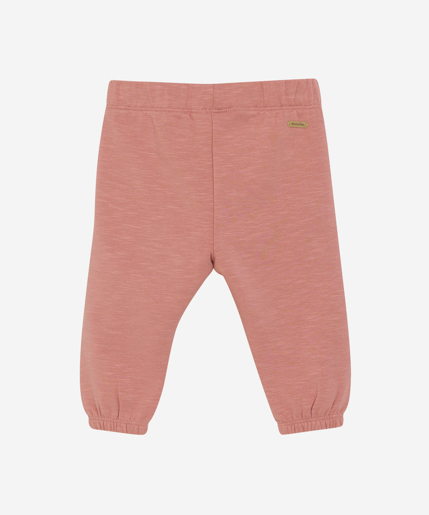 Details: These baby jogg pants are designed with comfort and style in mind. Soft and lightweight, each pair is equipped with an elastic waistband and a Bow on the front. Perfect for everyday wear.&nbsp; Color: Dusty rose&nbsp; Composition:&nbsp; Organic Sweat-slub Yarn 95% Cotton/ 5% Elastane &nbsp;