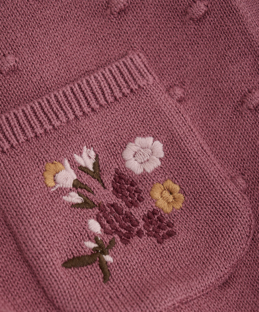 Details: &nbsp;This Knit Pocket Cardigan is a must-have for any fashionable wardrobe. With its knitted design, convenient pockets, and button closure, it offers both style and functionality. The embroidered flowers on the pockets add a charming touch, while the deco rose design adds a touch of elegance. Perfect for any occasion, this cardigan is a versatile and timeless piece.&nbsp;
Color: Deco rose&nbsp;&nbsp;
Composition:&nbsp;100% Cotton &nbsp;