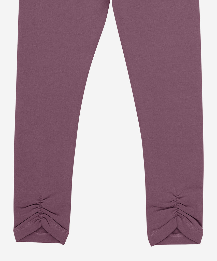 Details: &nbsp;Expertly crafted in soft, breathable fabric, these sweat leggings in black plum with unique detailing offer maximum comfort and style. The elastic waistband ensures a secure fit, while the effortlessly chic color adds a touch of sophistication to any workout. Experience the perfect blend of fashion and functionality.&nbsp; Color: Black plum&nbsp; Composition:&nbsp; Organic Sweat Brushed 95% Cotton/ 5% Elastane&nbsp;