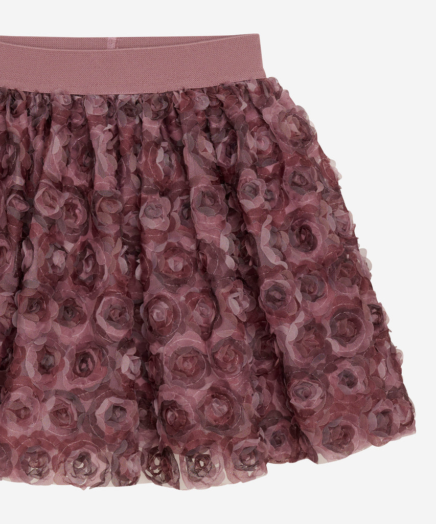 Details: &nbsp;This tulle skirt features elegant mesh flowers in a deco rose color and an elastic waistband for a comfortable fit. Add a touch of romance and femininity to any outfit with this beautiful skirt. Perfect for special occasions or everyday wear. &nbsp;
Color: Deco rose&nbsp;
Composition:&nbsp;100% Polyester&nbsp;
