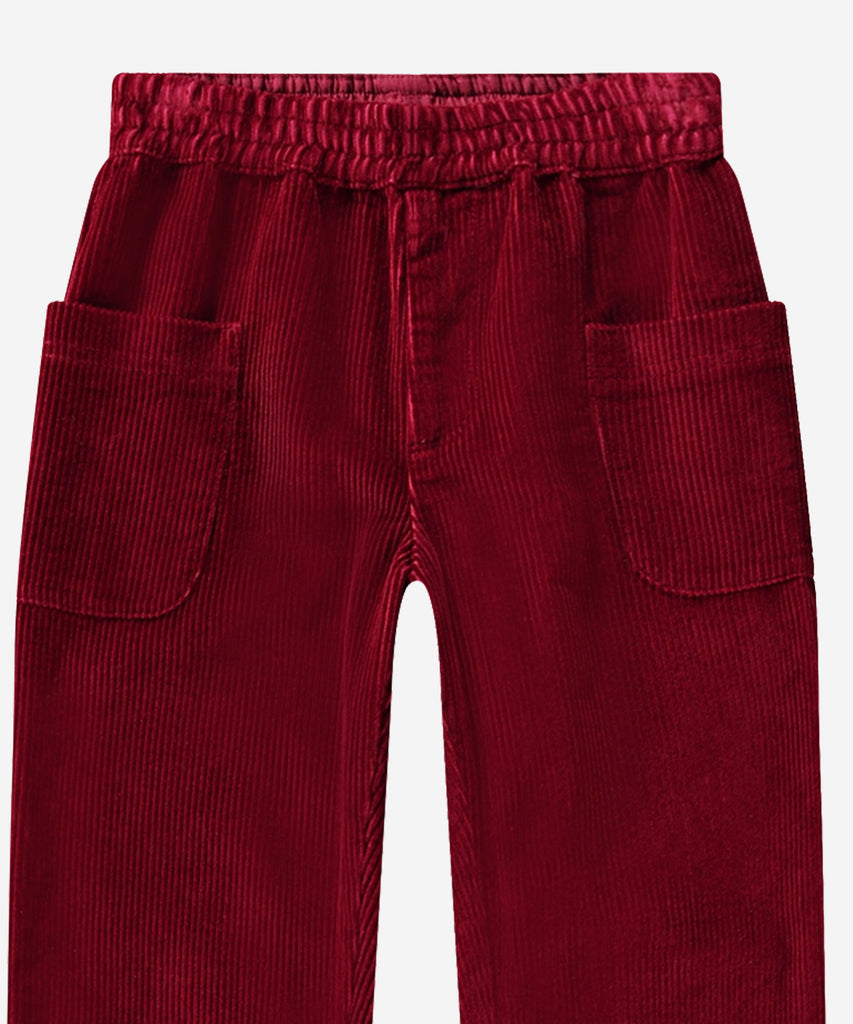 Details: Alfia is a pair of velvety red corduroy trousers in a relaxed, wide fit and with roll up at the legs. The trousers have large patch pockets at the sides and an elastic waist. Color: Velvety red&nbsp; Composition: 100% Cotton &nbsp;