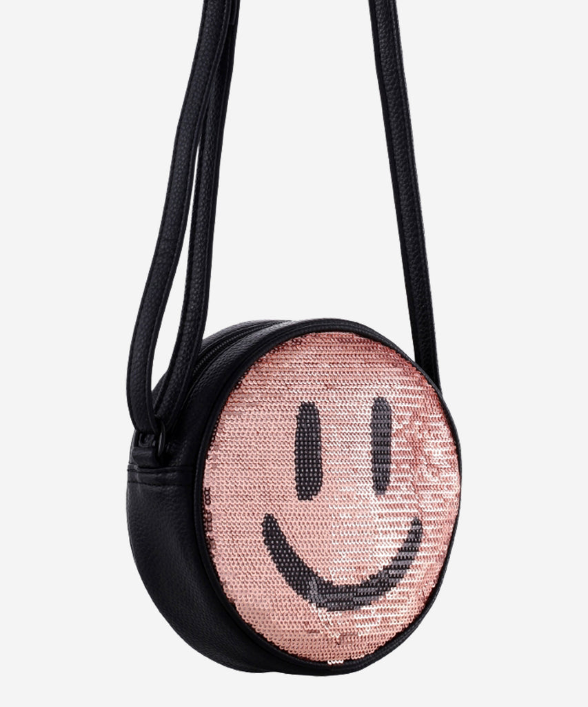 Details:&nbsp; Our Glitter Smiley Cross Body bag is the perfect companion for any adventure! This bag features an adorable Glitter Smiley design and zip closure to make sure your items are safe and secure. With this stylish bag, you're sure to be a hit no matter where your day takes you!&nbsp; Color: Glitter pink&nbsp; Composition:&nbsp; 100% Polyurethane&nbsp;