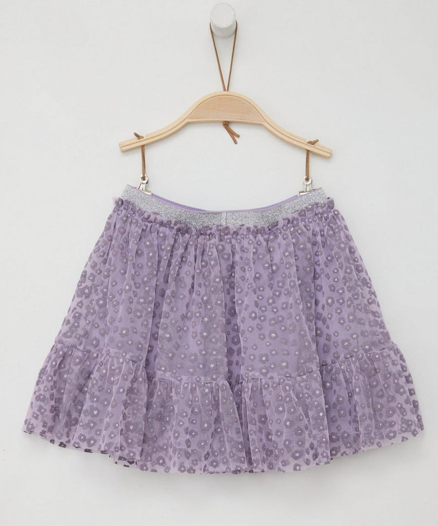 Details:&nbsp;This tulle lilac skirt is perfect for adding a touch of whimsy to your wardrobe. The all over print of delicate flowers&nbsp; creates a feminine and playful look. The elastic glitter waistband ensures a comfortable and secure fit. Be ready to twirl in this charming skirt.&nbsp;
Color: Lilac&nbsp;
Composition:&nbsp; 100%PES &nbsp;