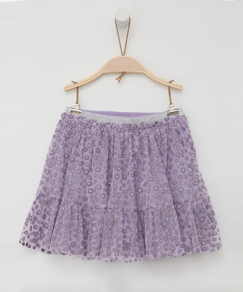 Details:&nbsp;This tulle lilac skirt is perfect for adding a touch of whimsy to your wardrobe. The all over print of delicate flowers&nbsp; creates a feminine and playful look. The elastic glitter waistband ensures a comfortable and secure fit. Be ready to twirl in this charming skirt.&nbsp;
Color: Lilac&nbsp;
Composition:&nbsp; 100%PES &nbsp;