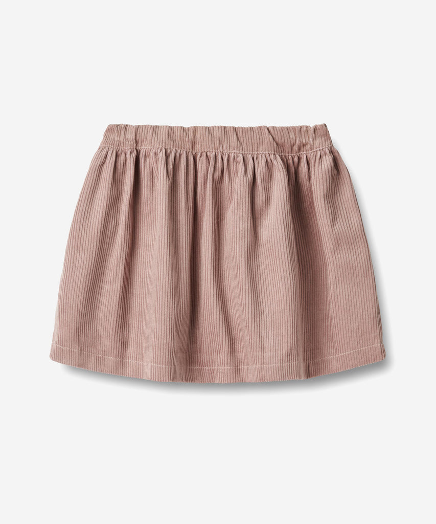 Details:
Sweet skirt in soft organic cotton for the junior child.
- Length: above knees
- Side pockets
- Adjustable elastic at the waist
- Gatherings below waistband
- Coduroy fabric
Wheat's lovely skirts can easily become a permanent part of your child’s everyday wardrobe depending on how you style them. Style them with some leggings, a T-shirt and a knit for the colder autumn and winter months. The skirt has a wide shape with an adjustable elastic at the waist and gatherings at the top for some volume. Th