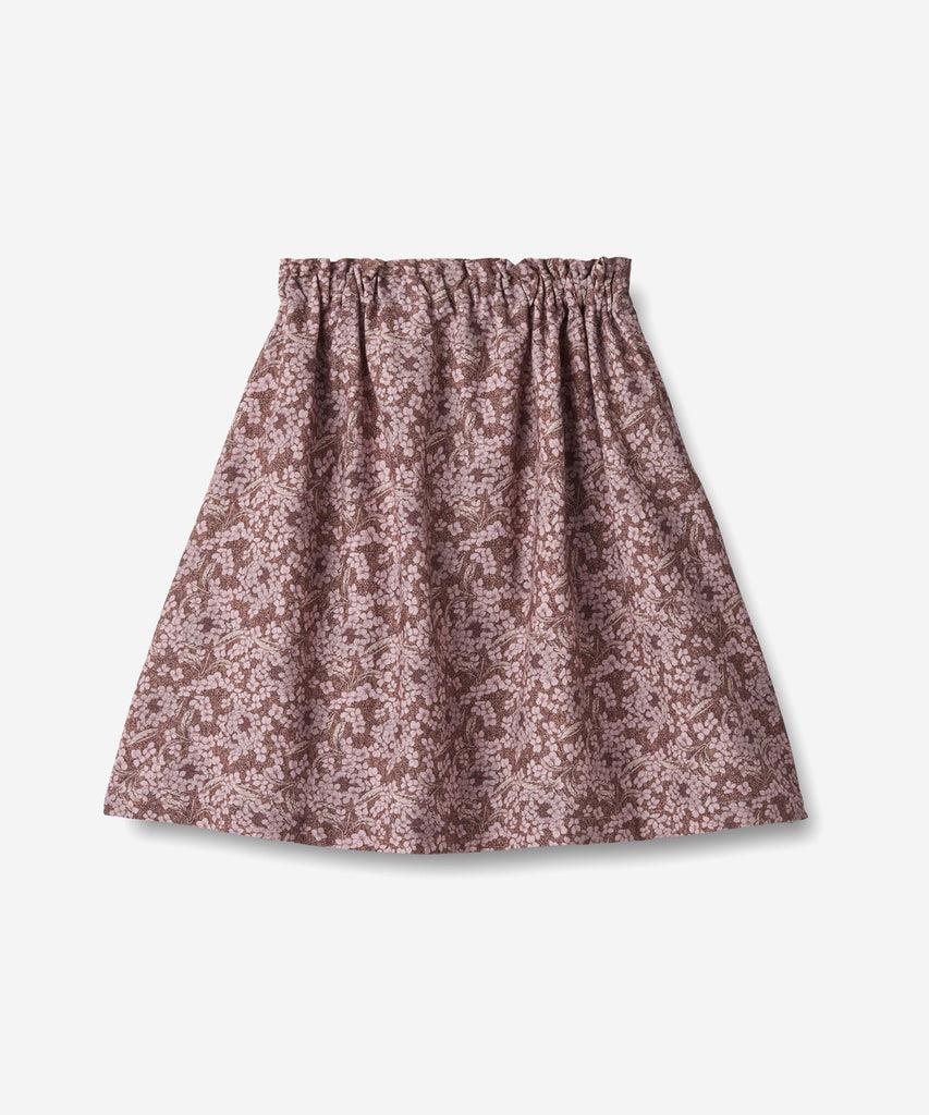 Details:&nbsp;
Lovely skirt with print in soft organic cotton for the junior child.
- Length: long
- Adjustable elastic at the waist
- Hand drawn all-over print
Wheat's lovely skirts can easily become a permanent part of your child’s everyday wardrobe depending on how you style them. Style them with some leggings, a T-shirt and a knit for the colder autumn and winter months. The skirt has a wide shape with an adjustable elastic at the waist and gatherings at the top for some volume. They are available in be